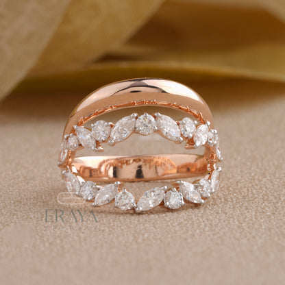Side profile of leaf-shaped marquise diamond ring highlighting curved gold design.