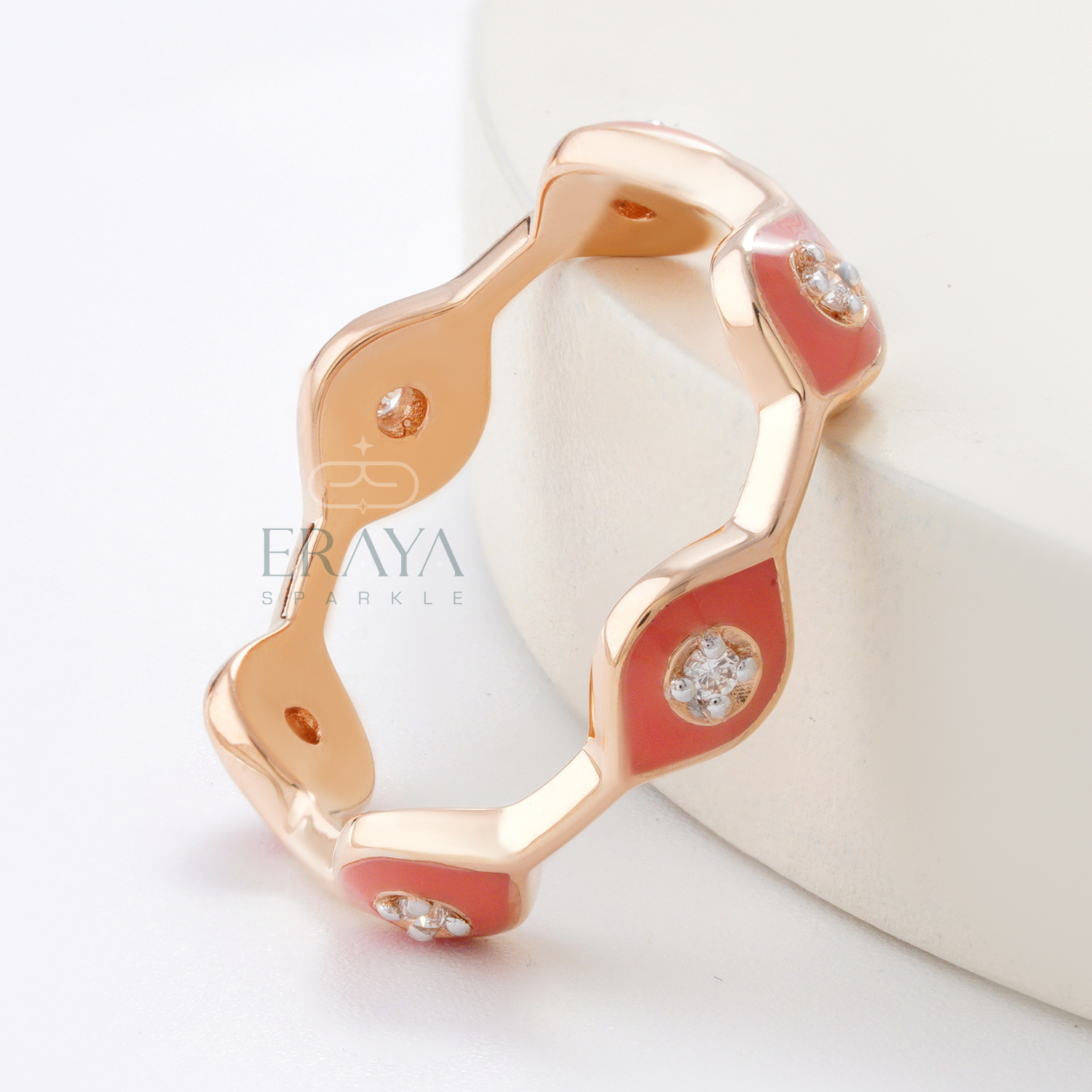 Rose gold stackable enamel ring with marquise-shaped pink design and diamonds