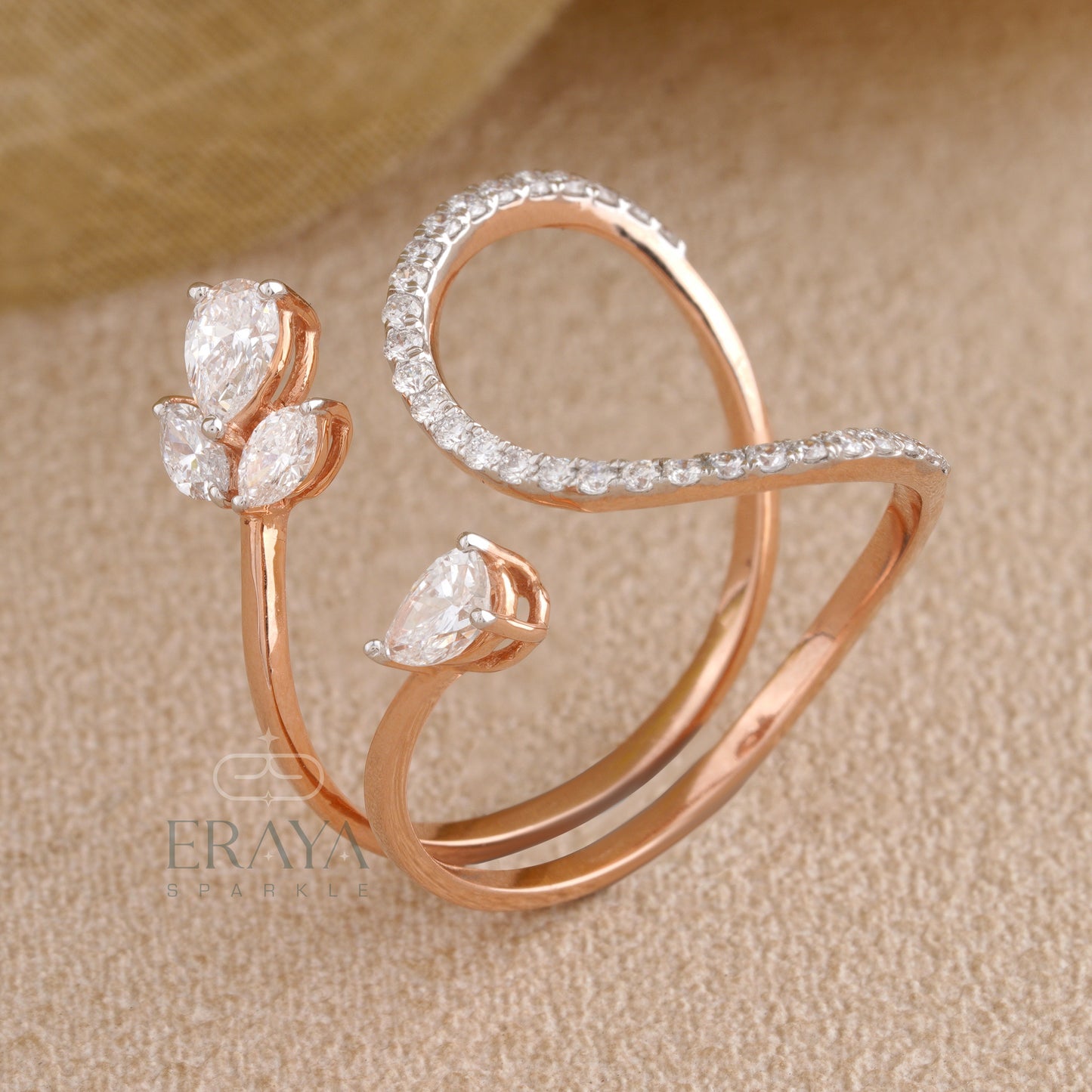 Top view of floral lab grown diamond ring in rose gold with marquise and pear stones