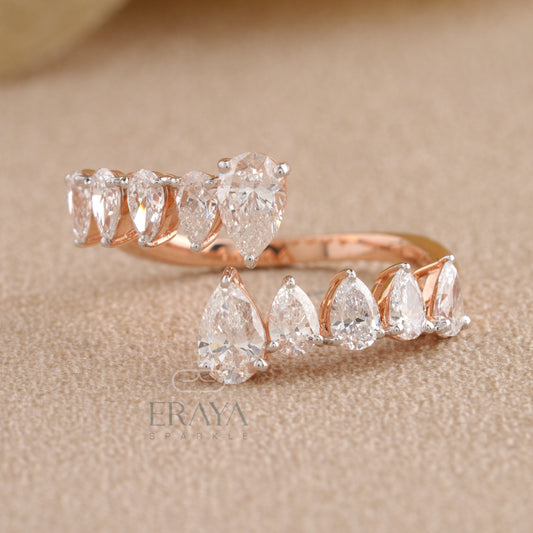 Front view of ERAYA open band pear diamond ring highlighting pear shapes and V-style curve