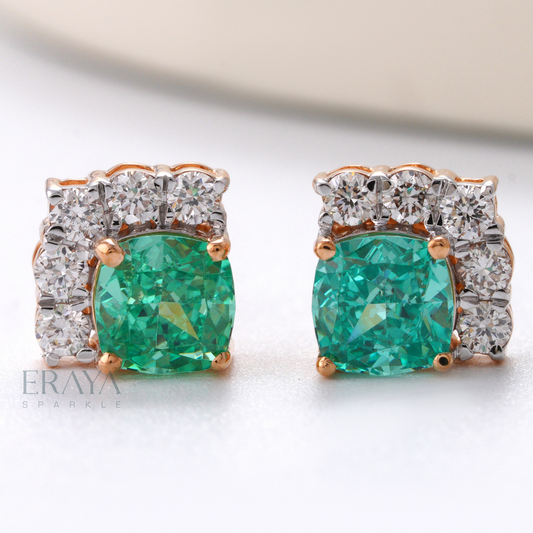 Front view of green cushion-cut stone stud earrings with lab-grown diamond halo