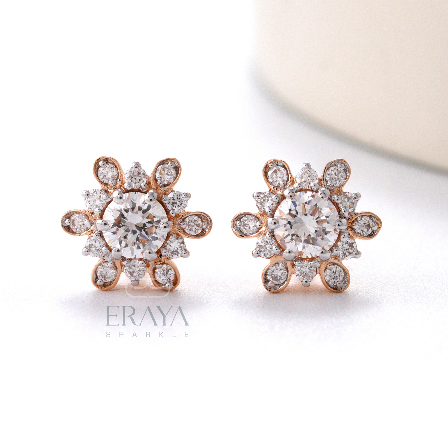 Front view of sunburst floral halo diamond stud earrings in rose gold