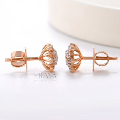 Side profile of rose gold sunburst diamond earrings with halo detailing