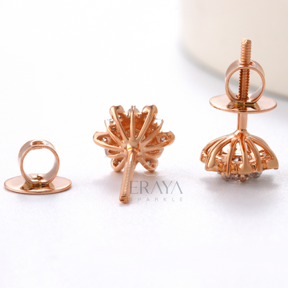 Complete breakdown view of sunburst diamond studs showing center stone and halo arrangement