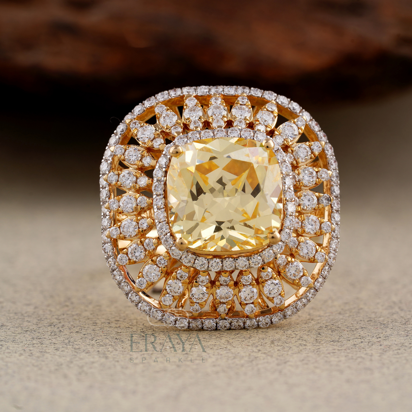 Front view highlighting cushion cut center stone and sparkling diamond halo