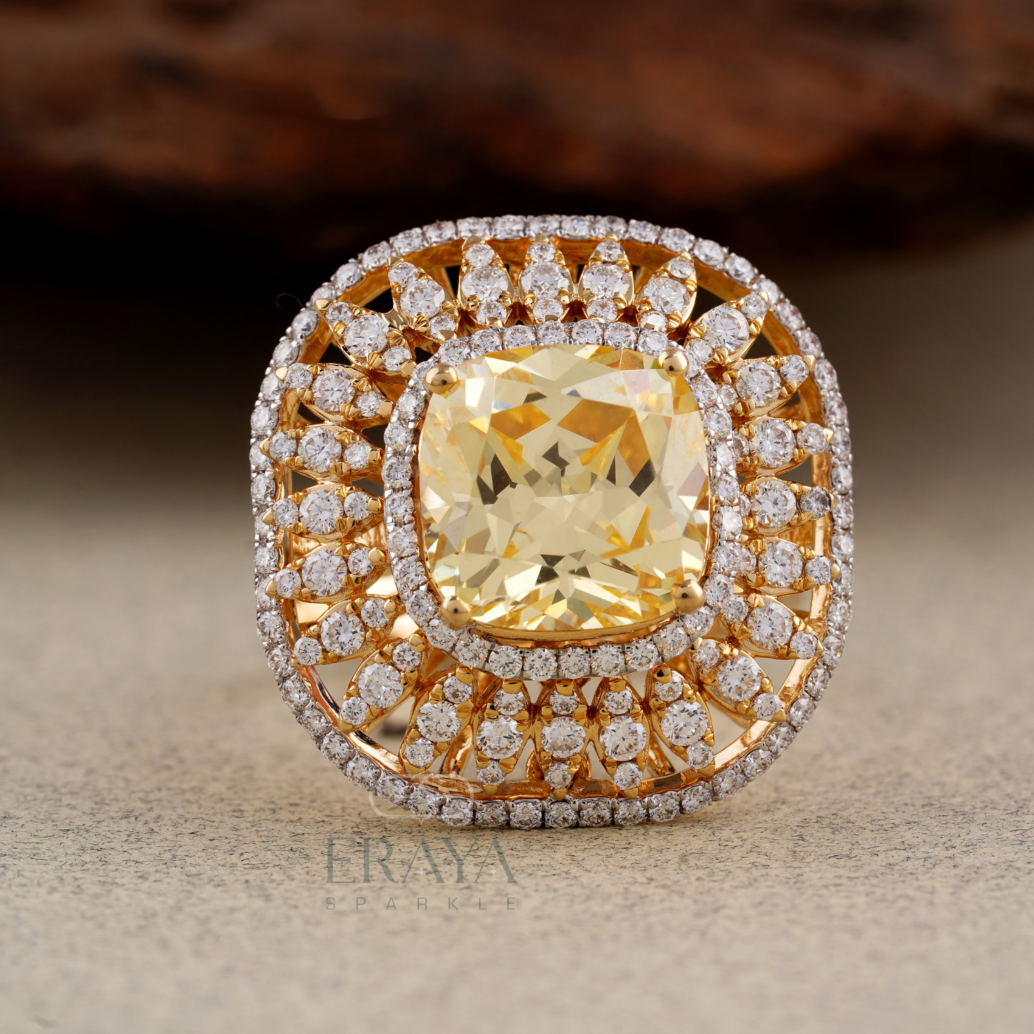 Front view highlighting cushion cut center stone and sparkling diamond halo