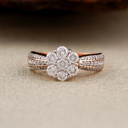 Rose gold and silver ring with diamond accents on a textured surface