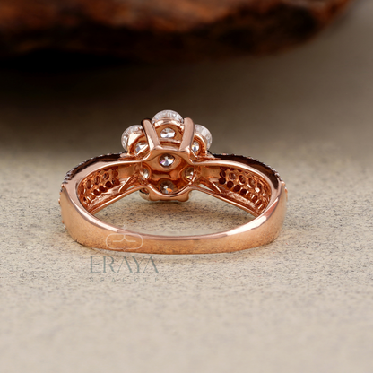 Rose gold ring with intricate design on a textured surface, featuring the brand 'Eraya'.