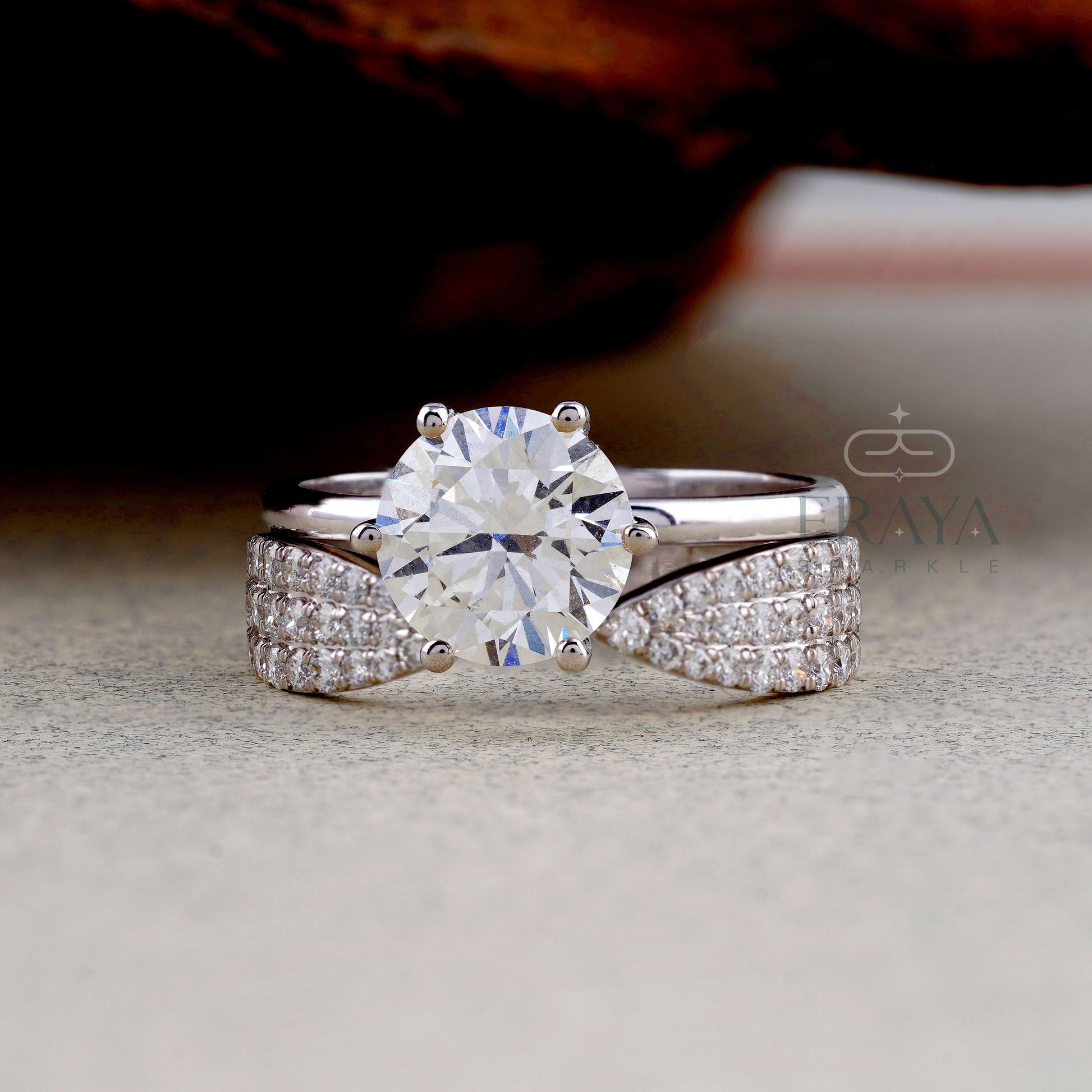 White gold bridal ring set featuring stackable pavé diamond band and lab created center stone