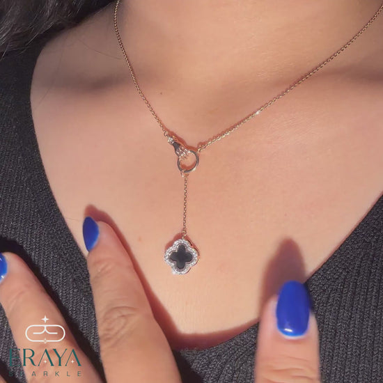 hands-on 360° view of rose gold hand motif and black enamel clover necklace showing lab-grown diamonds
