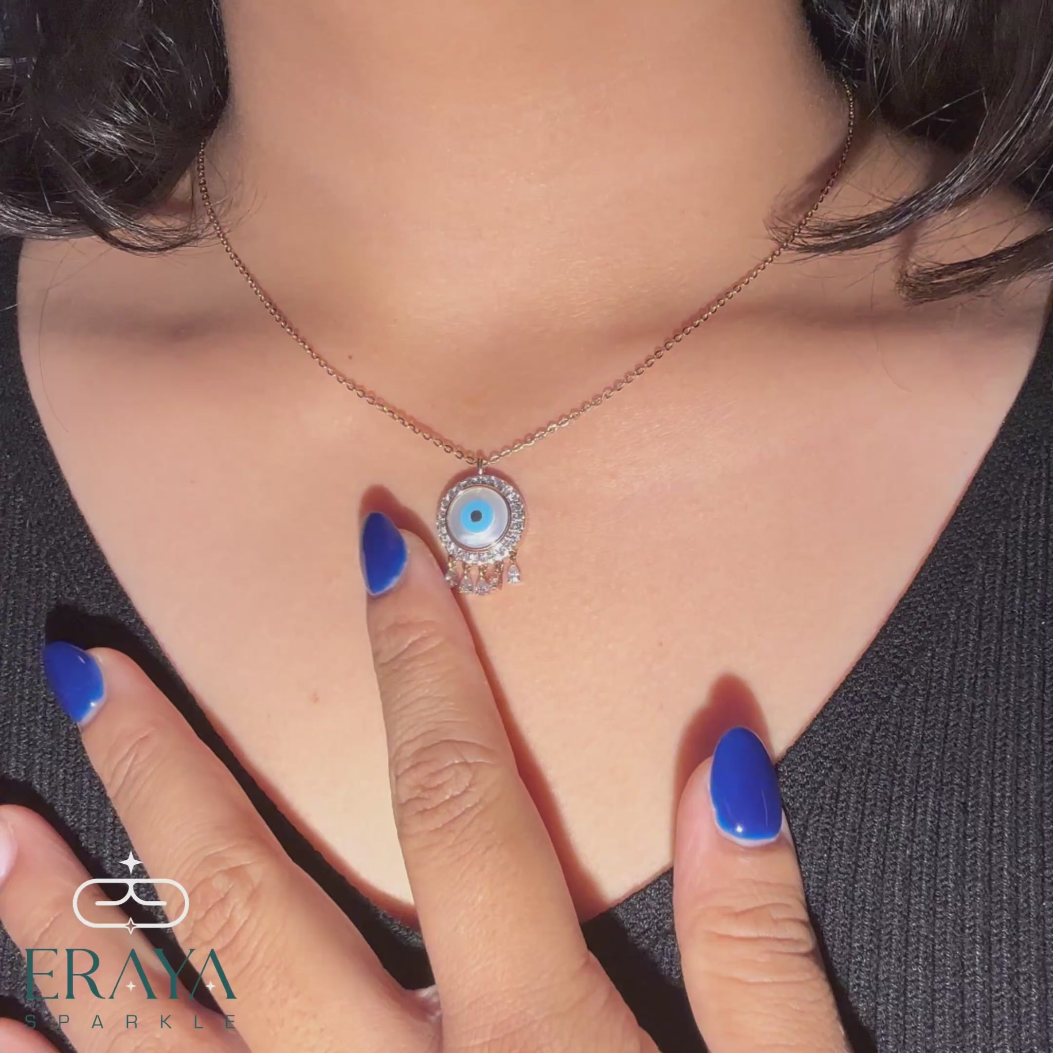hands-on view of lab grown diamond evil eye necklace from all sides - mother-of-pearl center and diamond drops