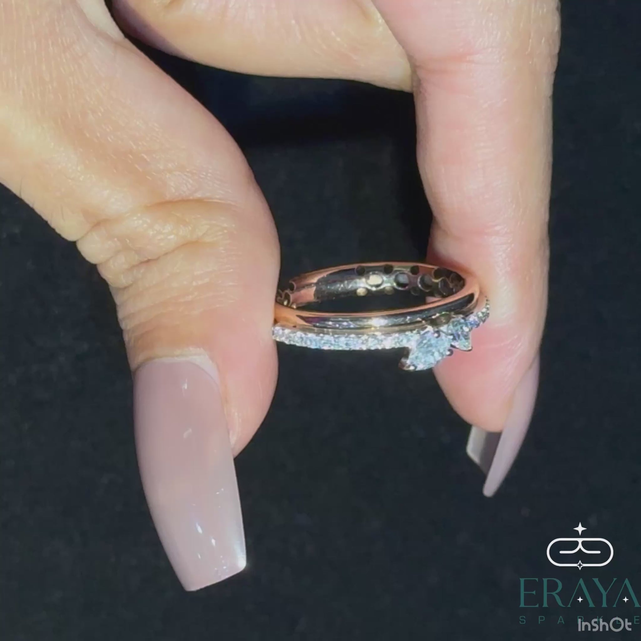 (360° video) Spinning 360-degree view of pear cut dual-diamond gold ring