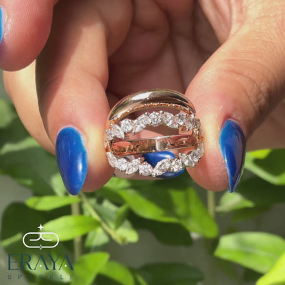 Angled shot of marquise and round diamond leaf ring showcasing sparkle and craftsmanship.