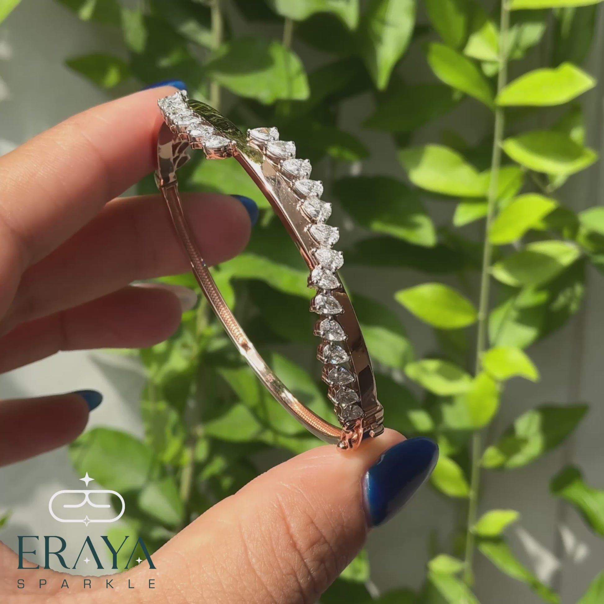 Close-up of pear cut diamonds on rose gold bracelet