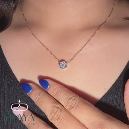 Model wearing snowflake necklace — back of neck and pendant in natural light